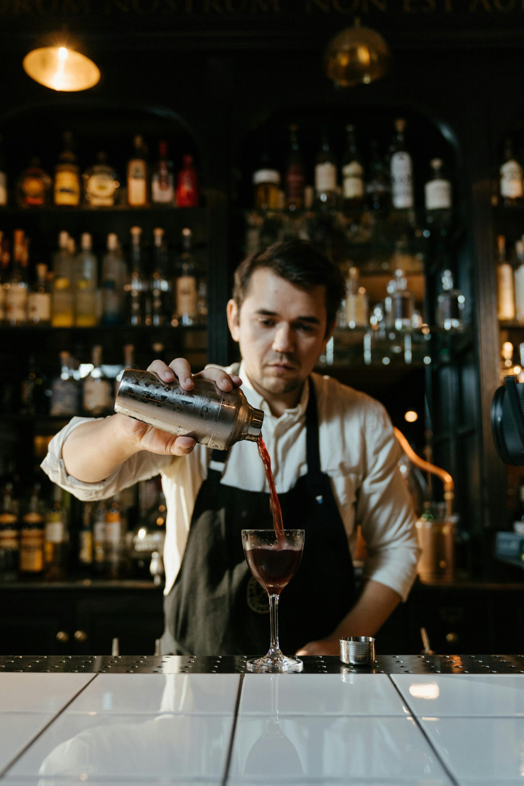 Bartender pouring cocktail