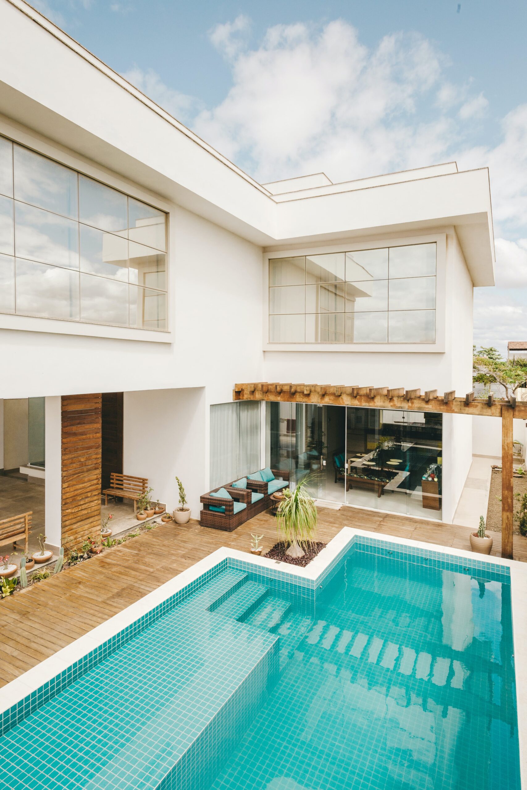 View of a pool in the back of a beautiful home