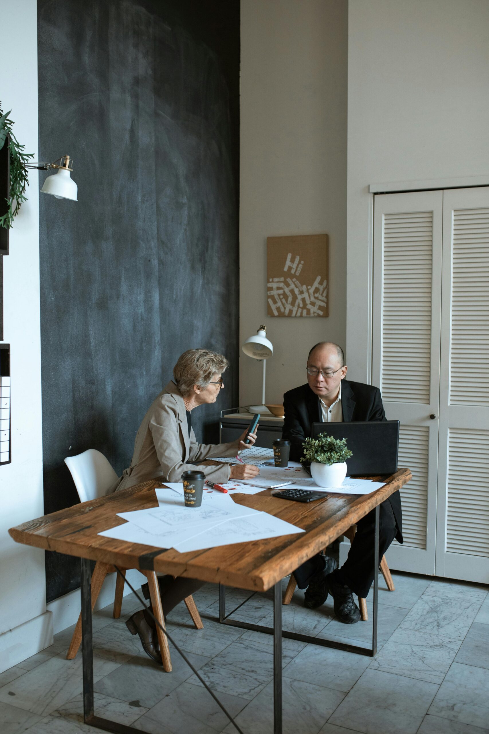 2 professionals meeting at a conference table