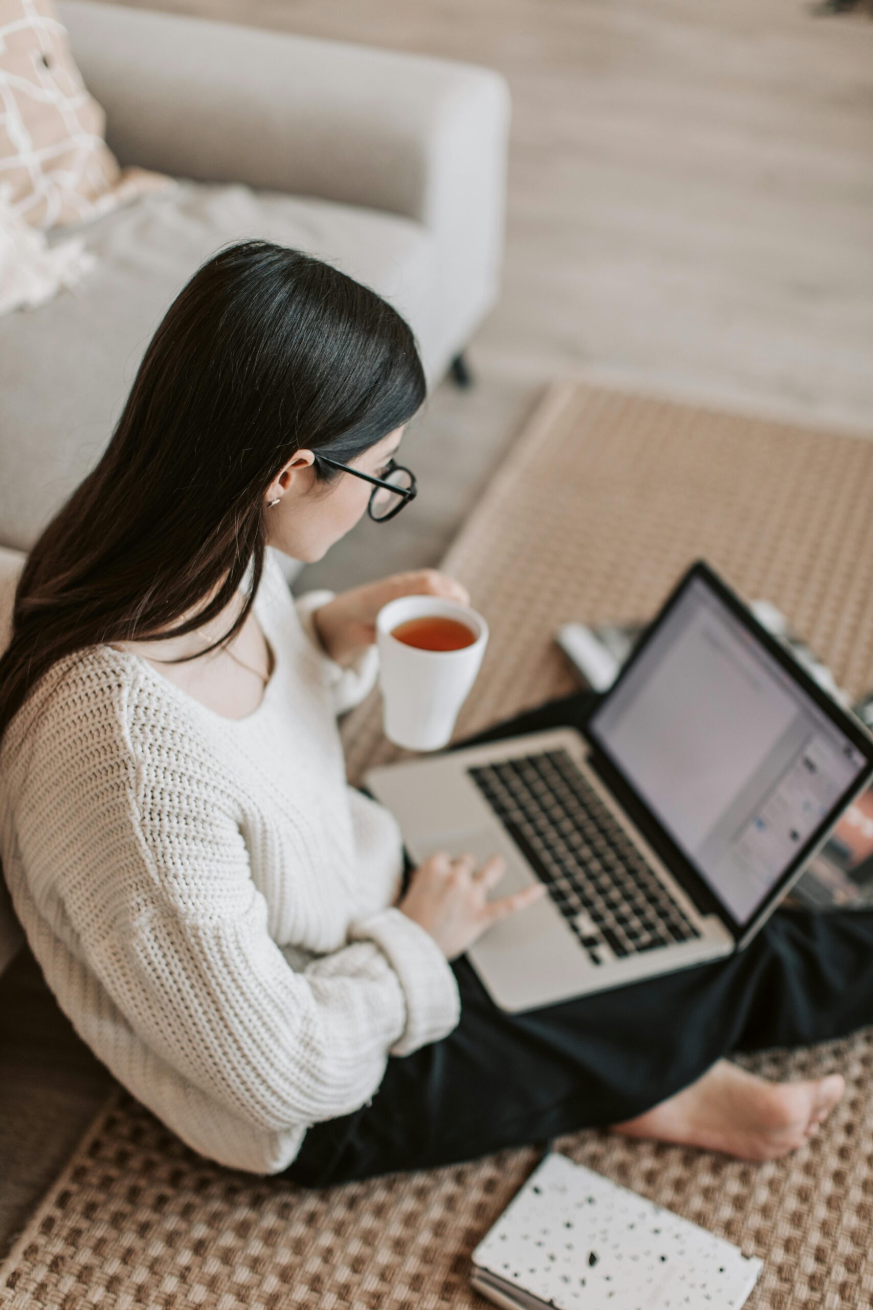 woman working on a laptop in her living room