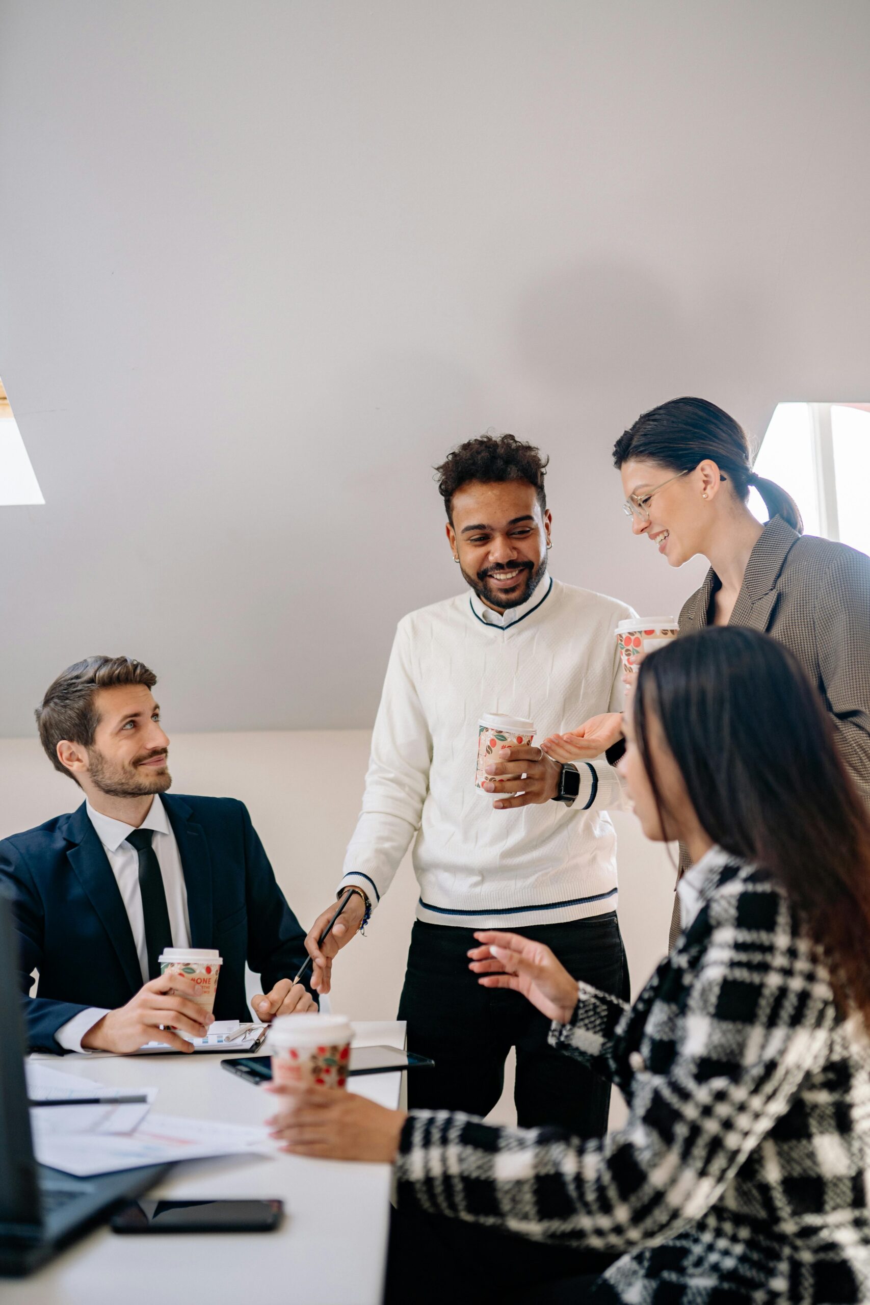 Four professionals in an engaging meeting