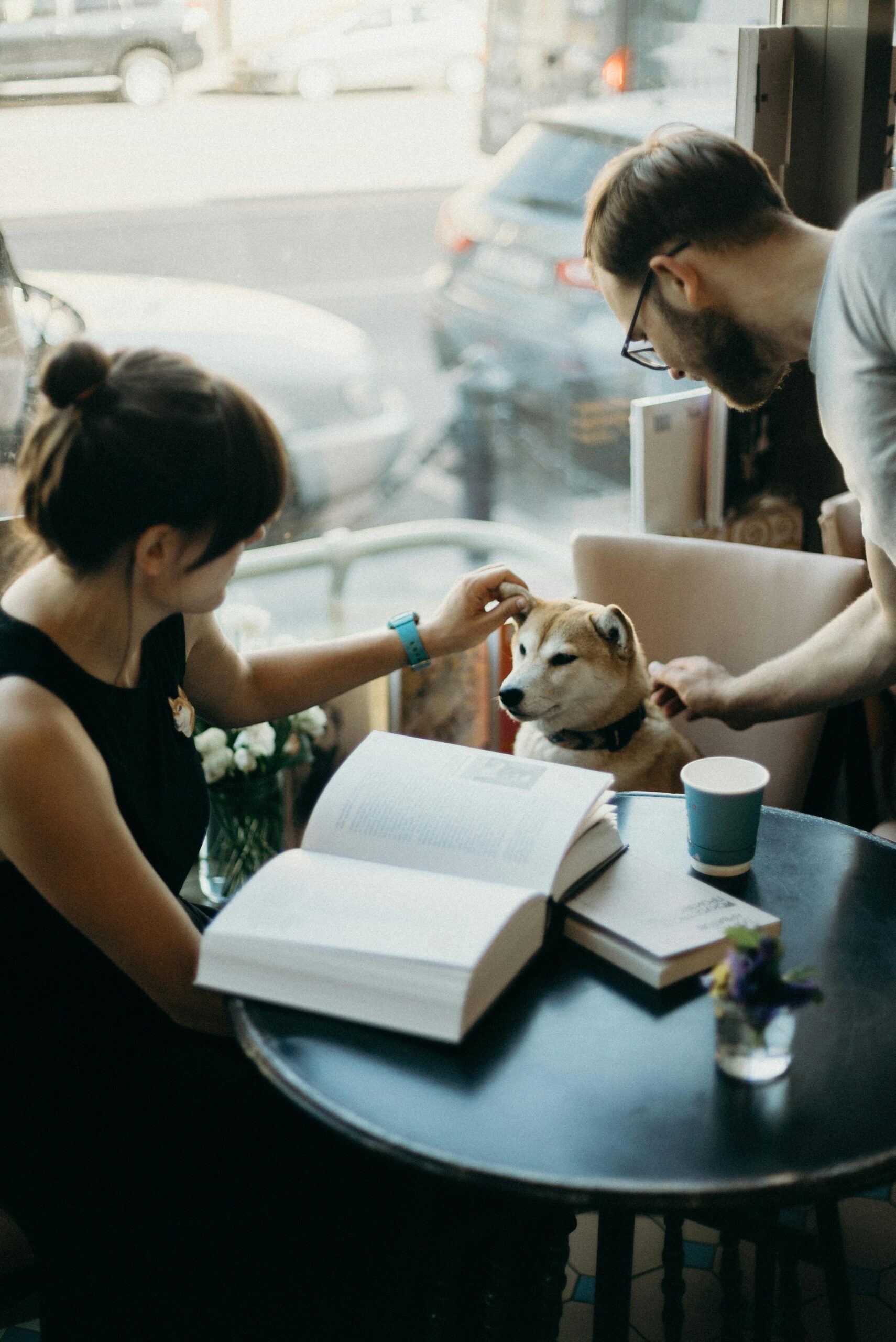 Couple with pet in coffee shop
