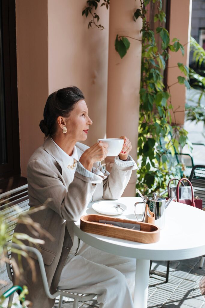 Woman drinking coffee and thinking about legacy planning