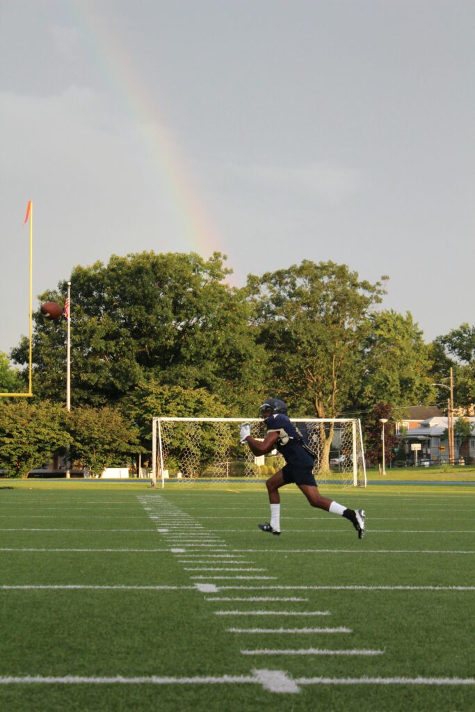 Football athlete running for goal