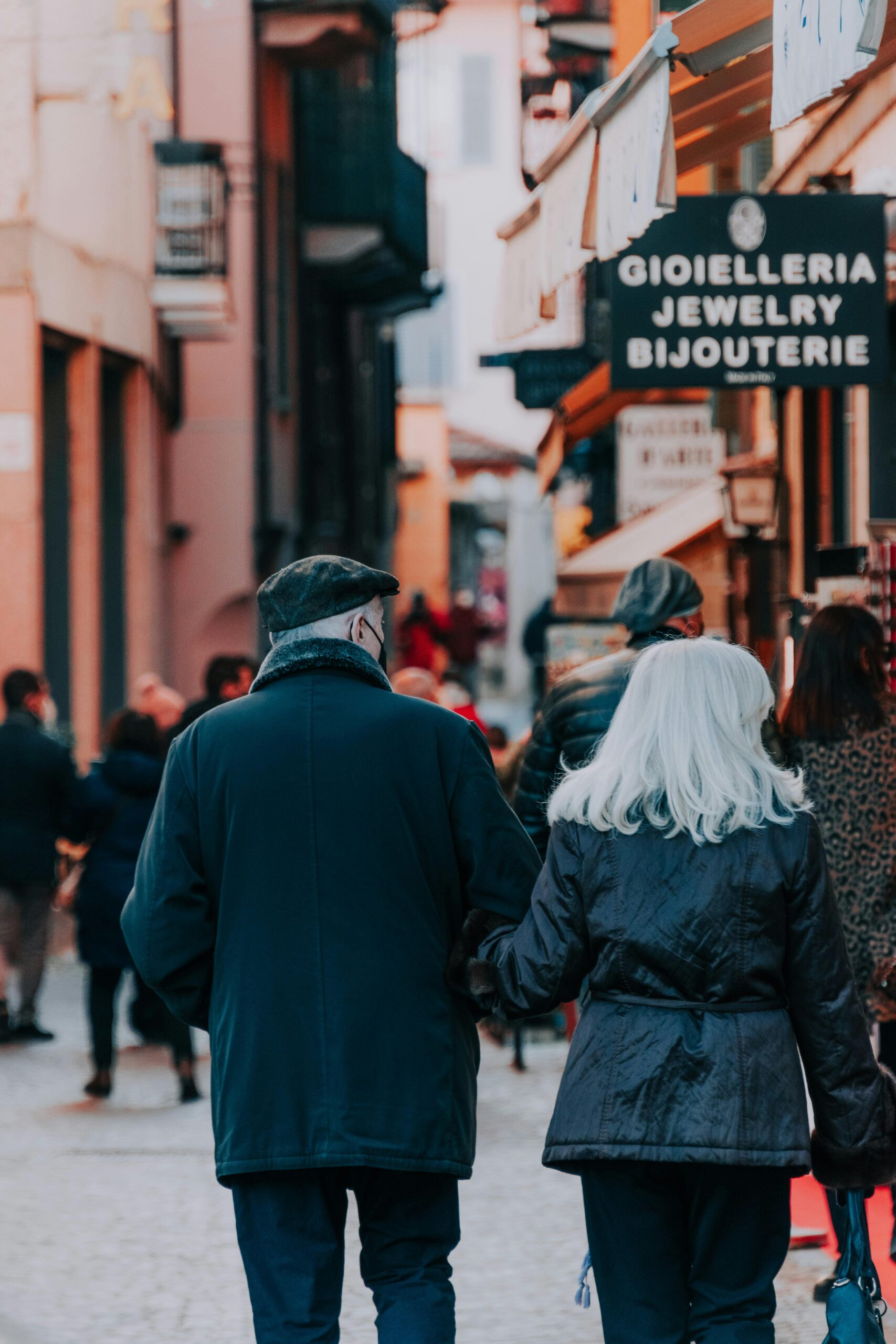 older couple walking though the city