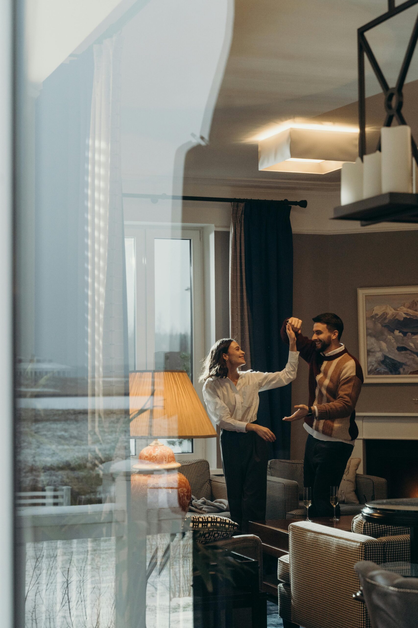Couple dancing in living room