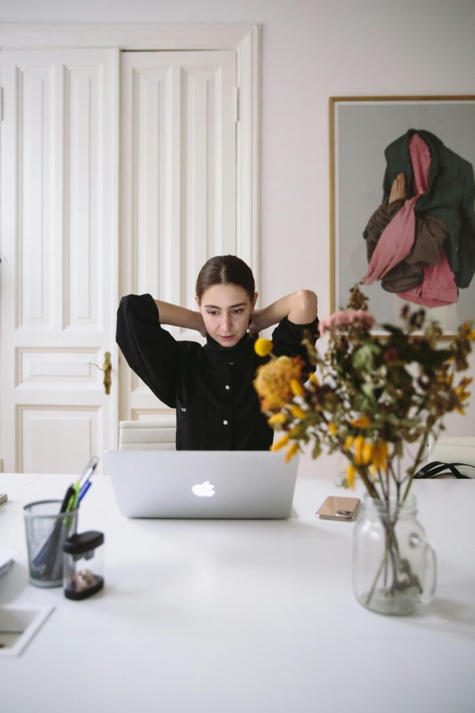 Woman reviewing investments on laptop