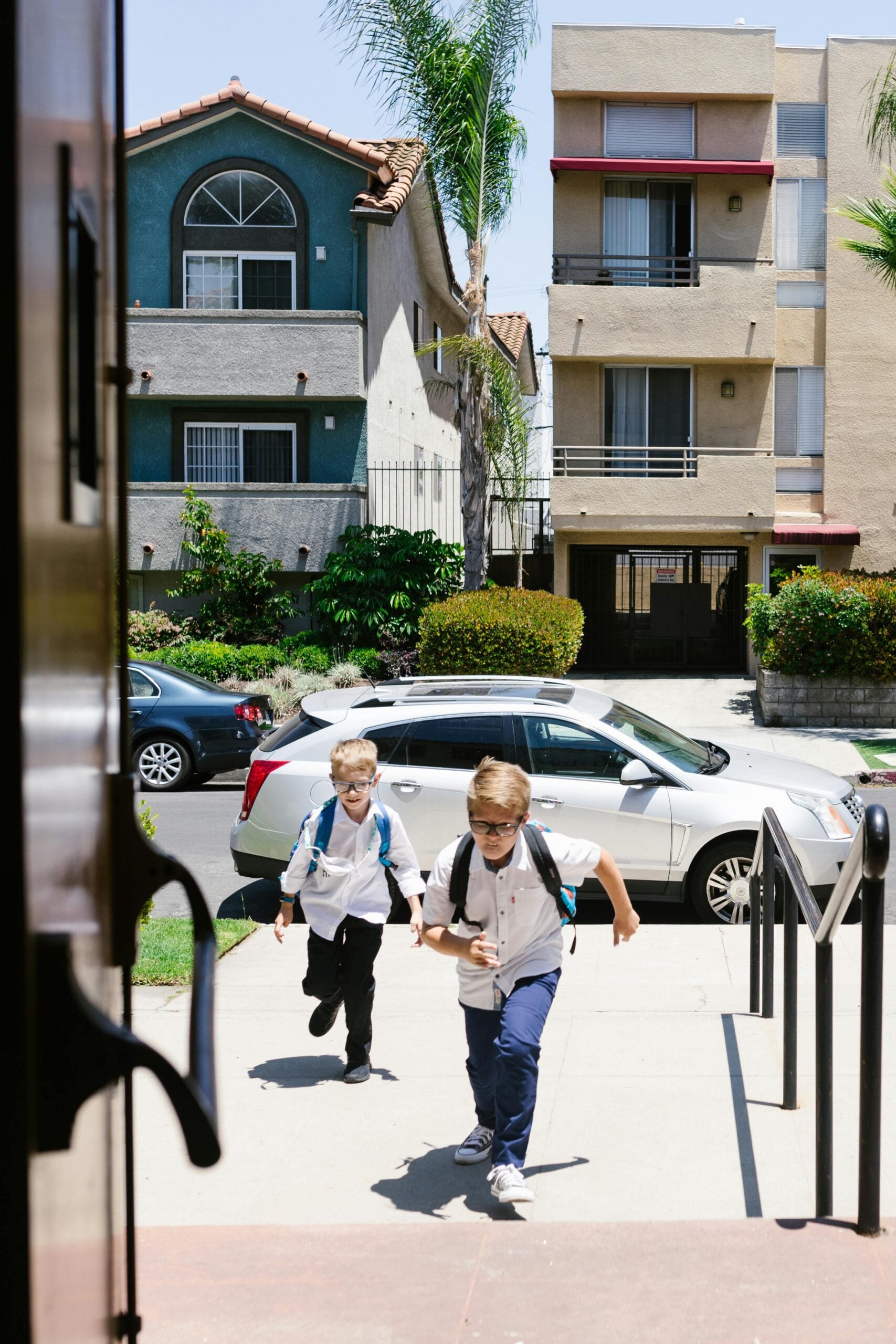 Kids running into home from school